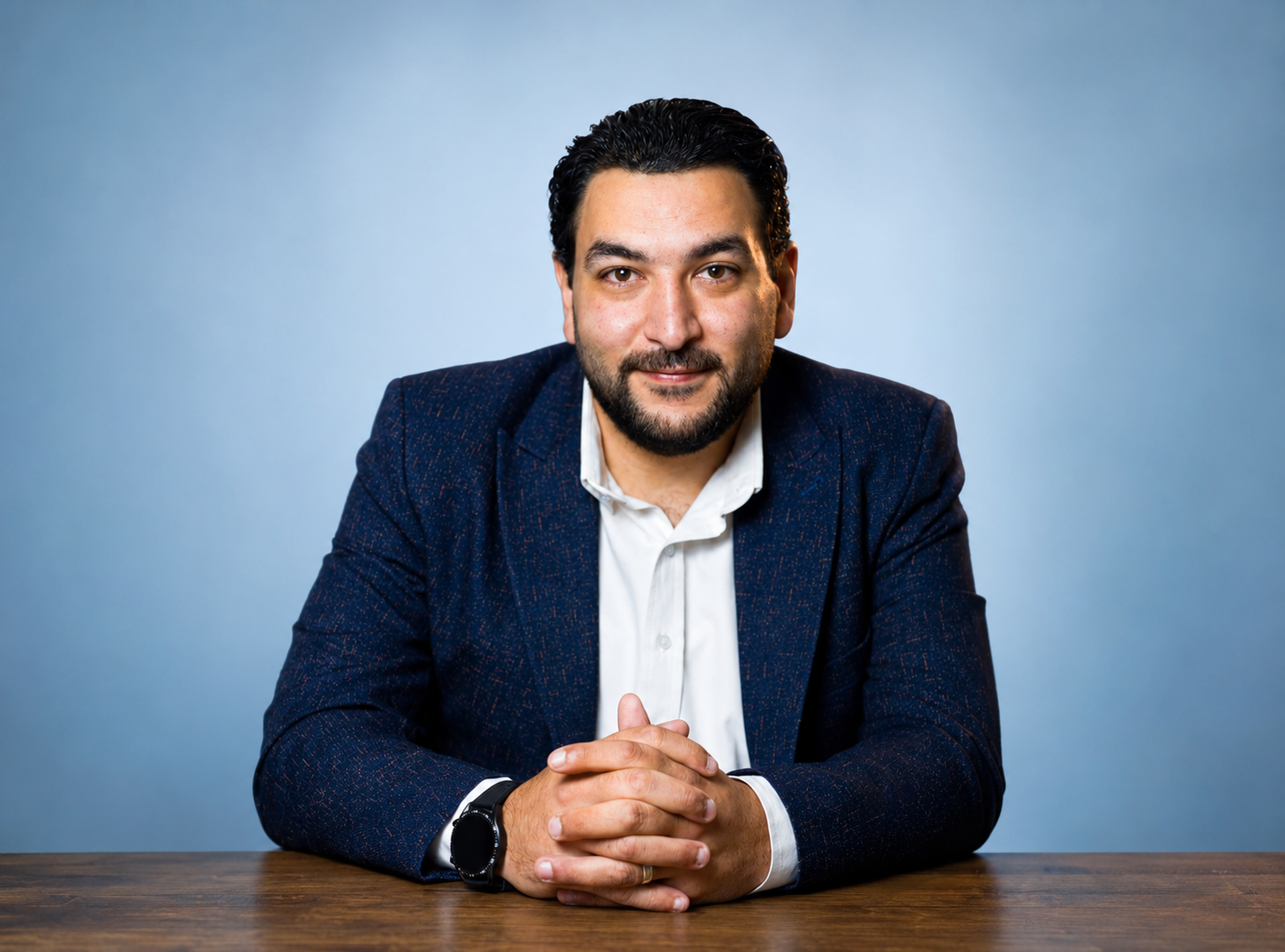 Dr Mohamed El-Zohairy seated at his clinic desk